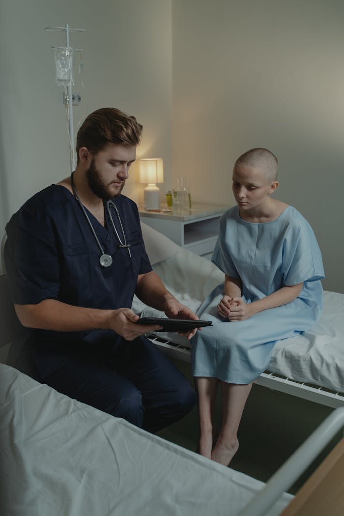 Nurse assisting a patient in a hospital room, highlighting care and support.